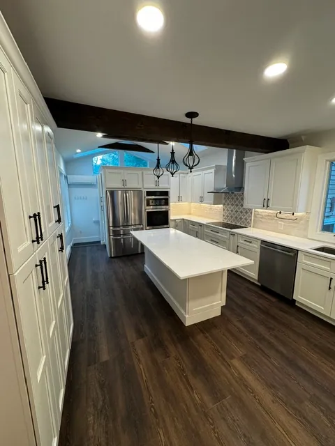 Open-Plan Kitchen by YK United Builders — Wall removal and new layout
